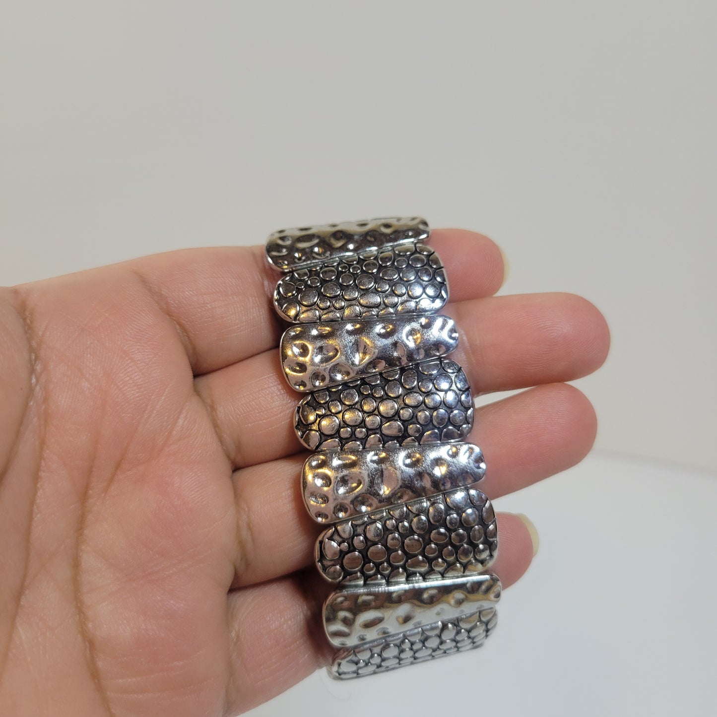 Silver-toned Bracelet with Asymmetric Pattern.