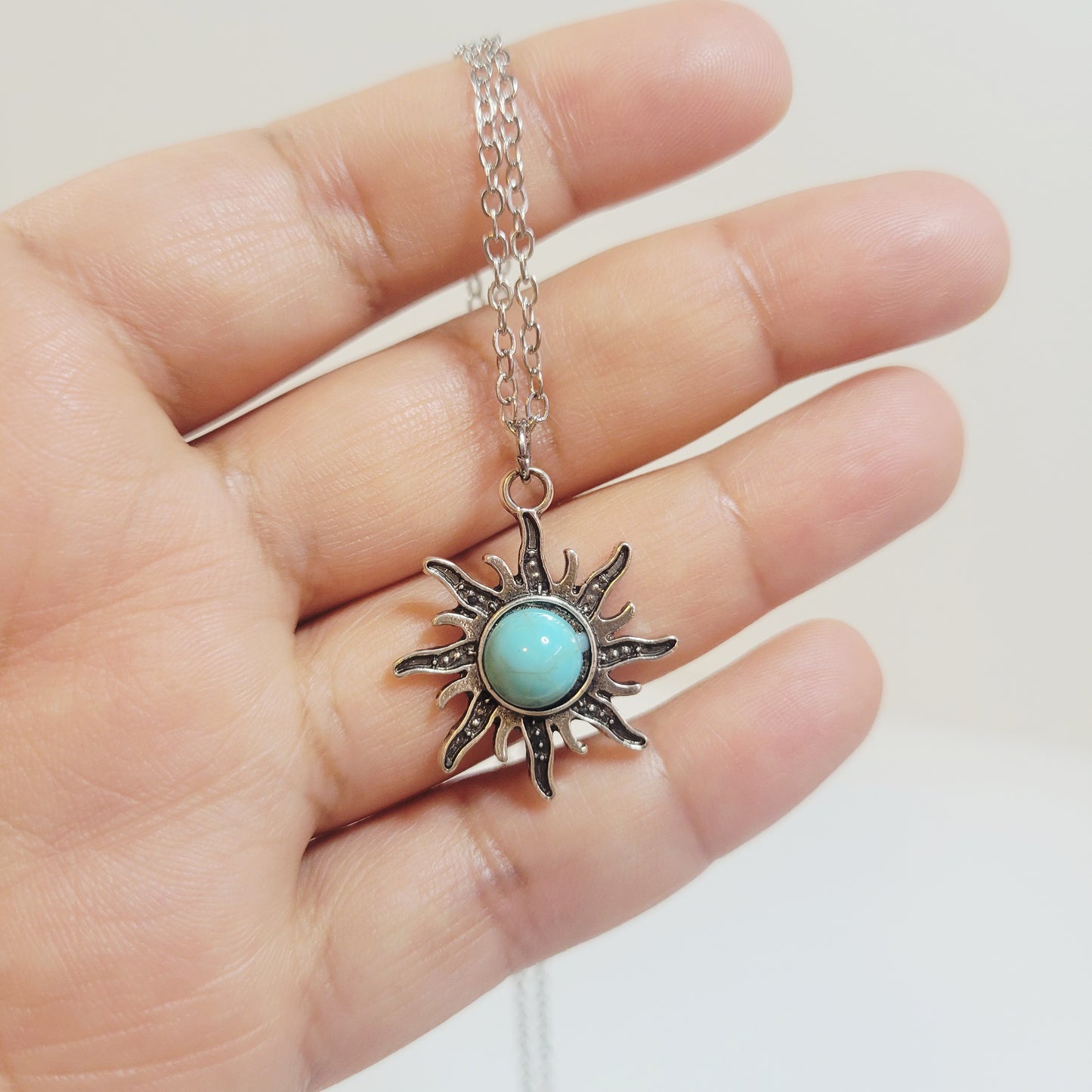 Turquoise Sun Pendant. Gold-toned.