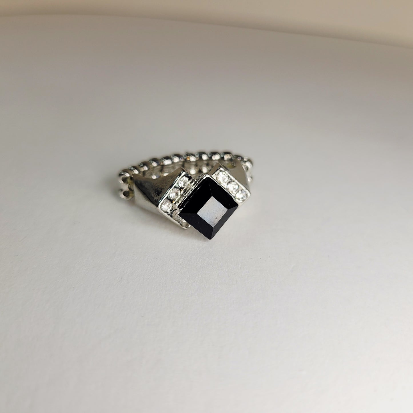 Black Rhinestone Ring. Size 7. Extendable. Silver-toned Elastic backing.
