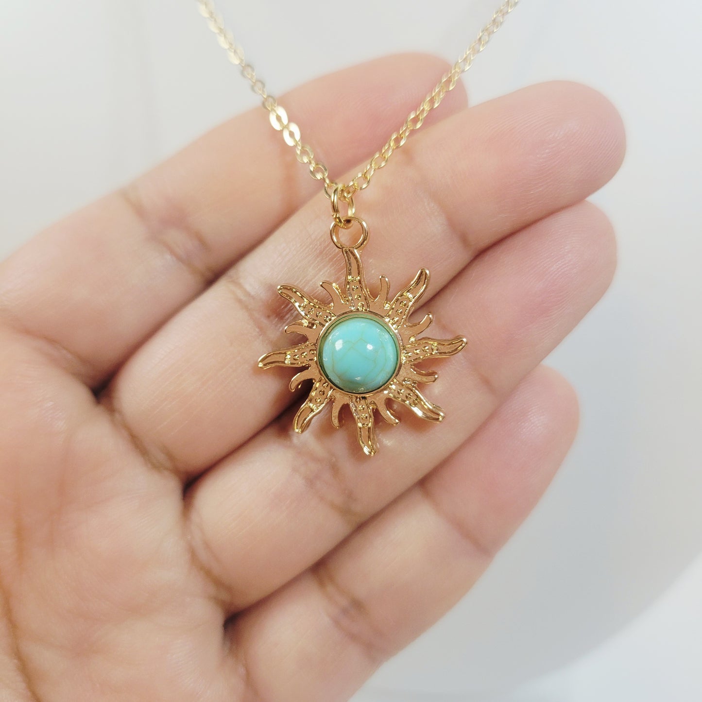 Turquoise Sun Pendant. Gold-toned.