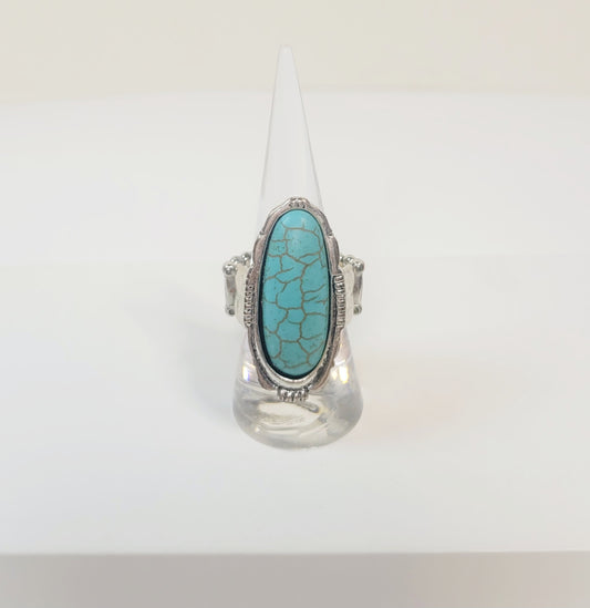 Oval Turquoise Ring. Silver-toned and elastic band.