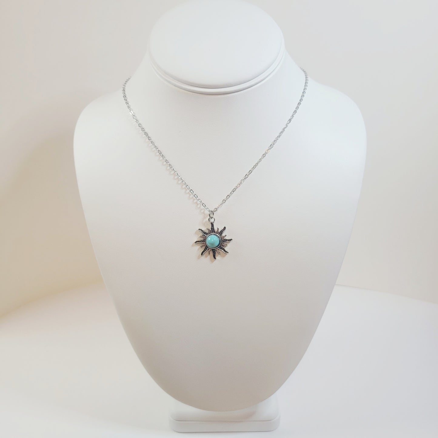 Turquoise Sun Pendant. Gold-toned.