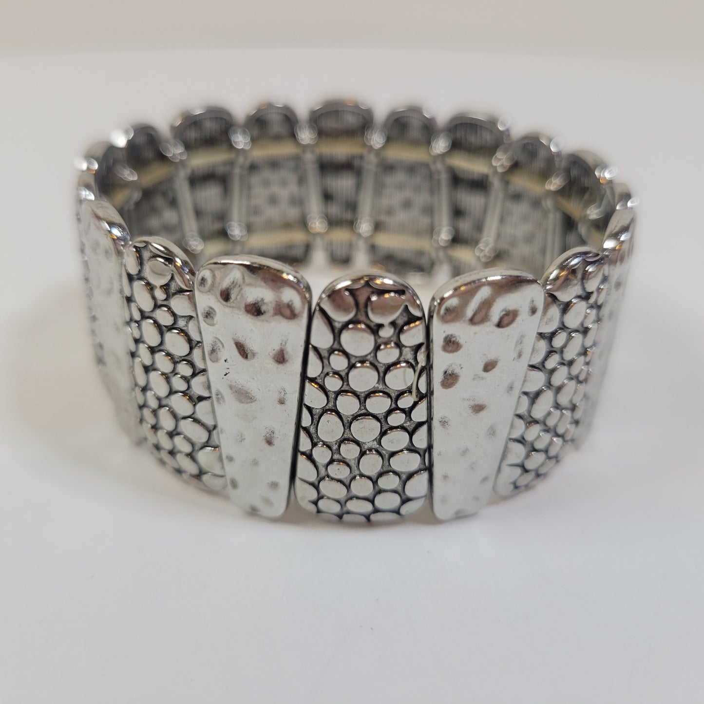Silver-toned Bracelet with Asymmetric Pattern.