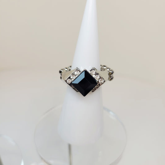 Black Rhinestone Ring. Size 7. Extendable. Silver-toned Elastic backing.