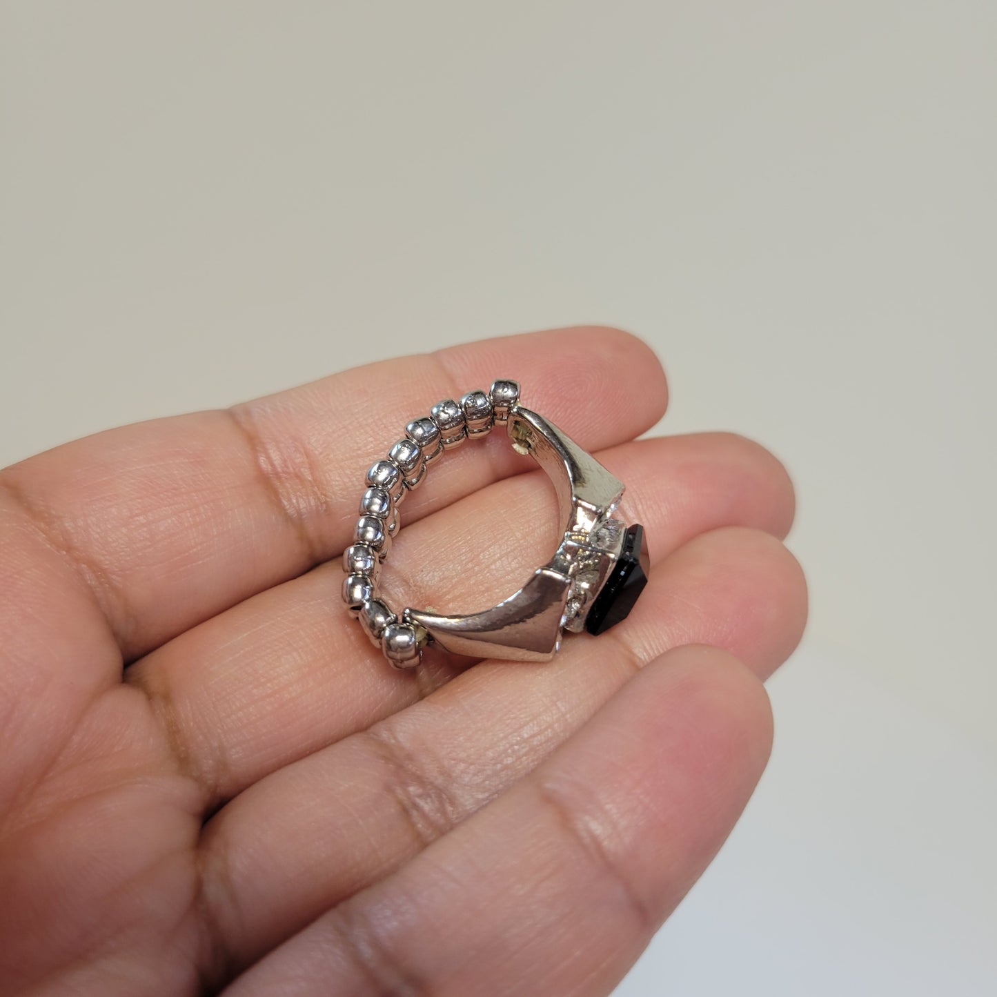Black Rhinestone Ring. Size 7. Extendable. Silver-toned Elastic backing.