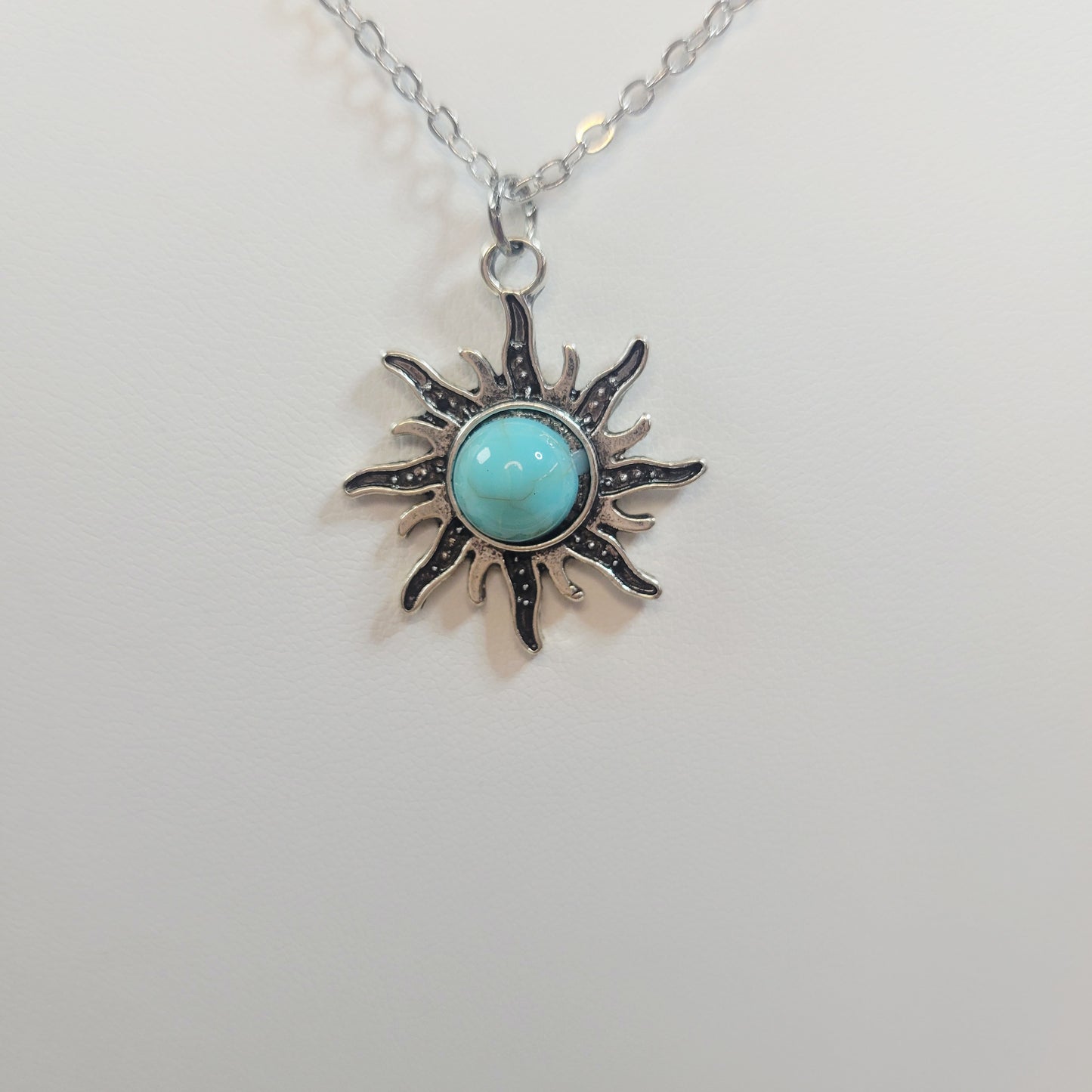 Turquoise Sun Pendant. Gold-toned.