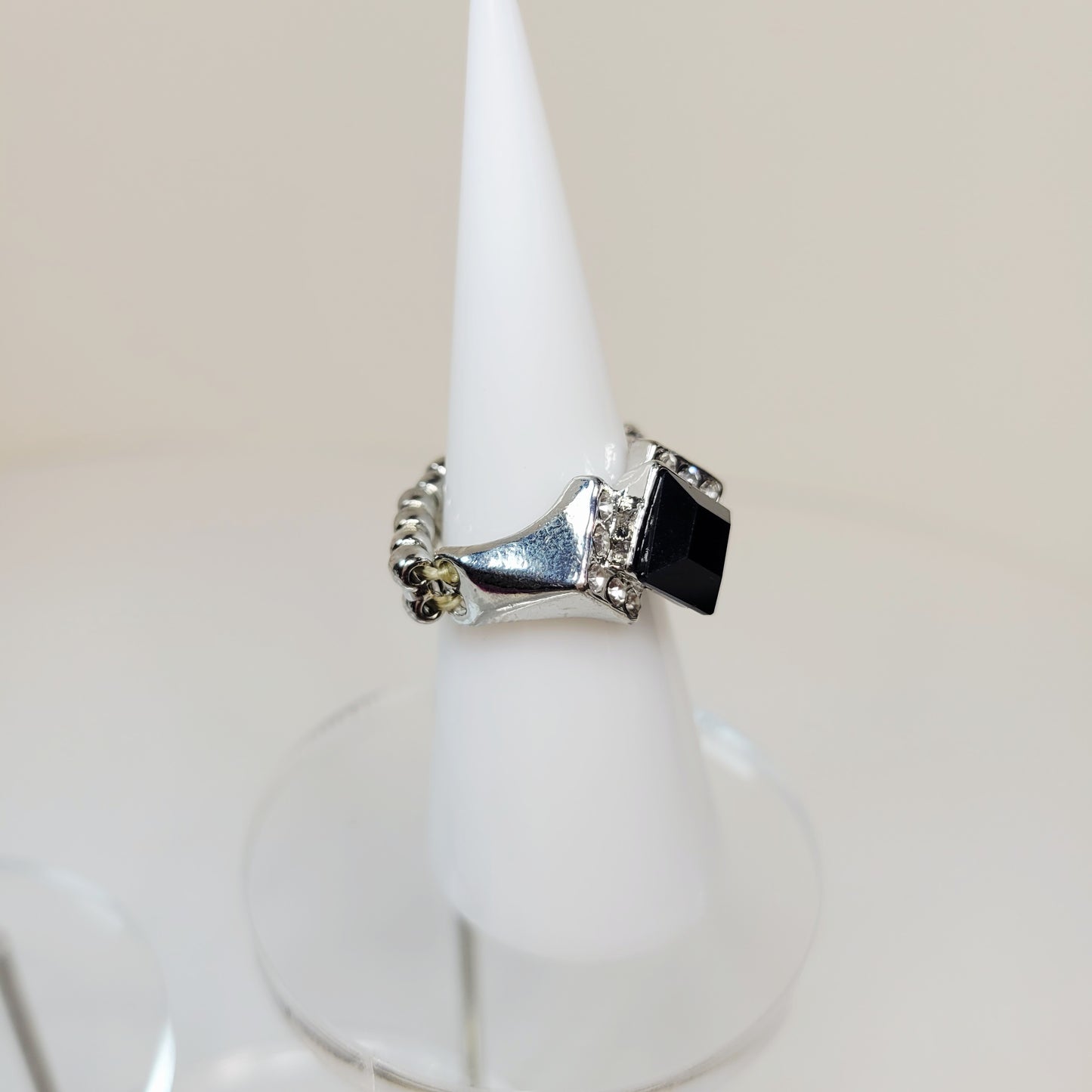 Black Rhinestone Ring. Size 7. Extendable. Silver-toned Elastic backing.