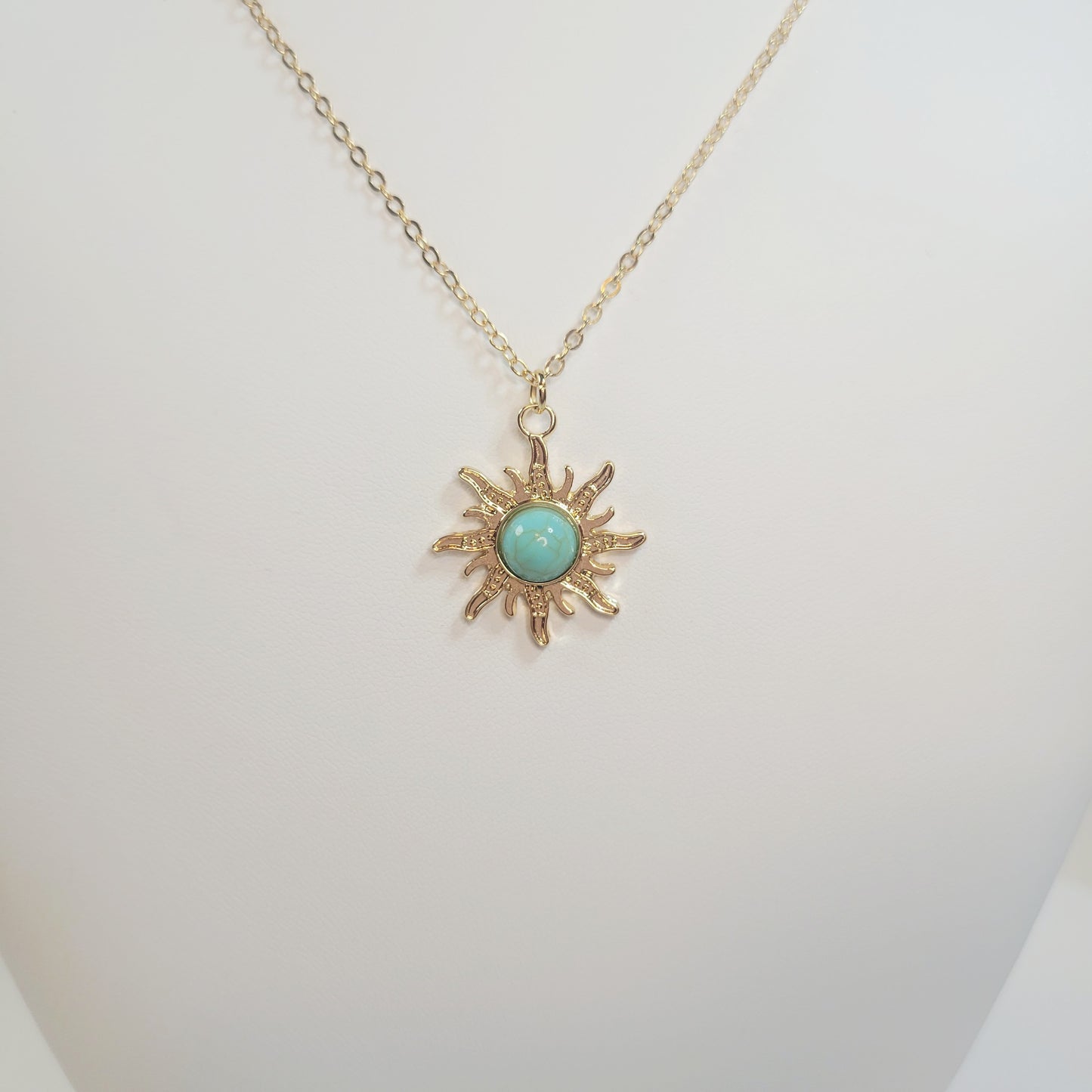 Turquoise Sun Pendant. Gold-toned.