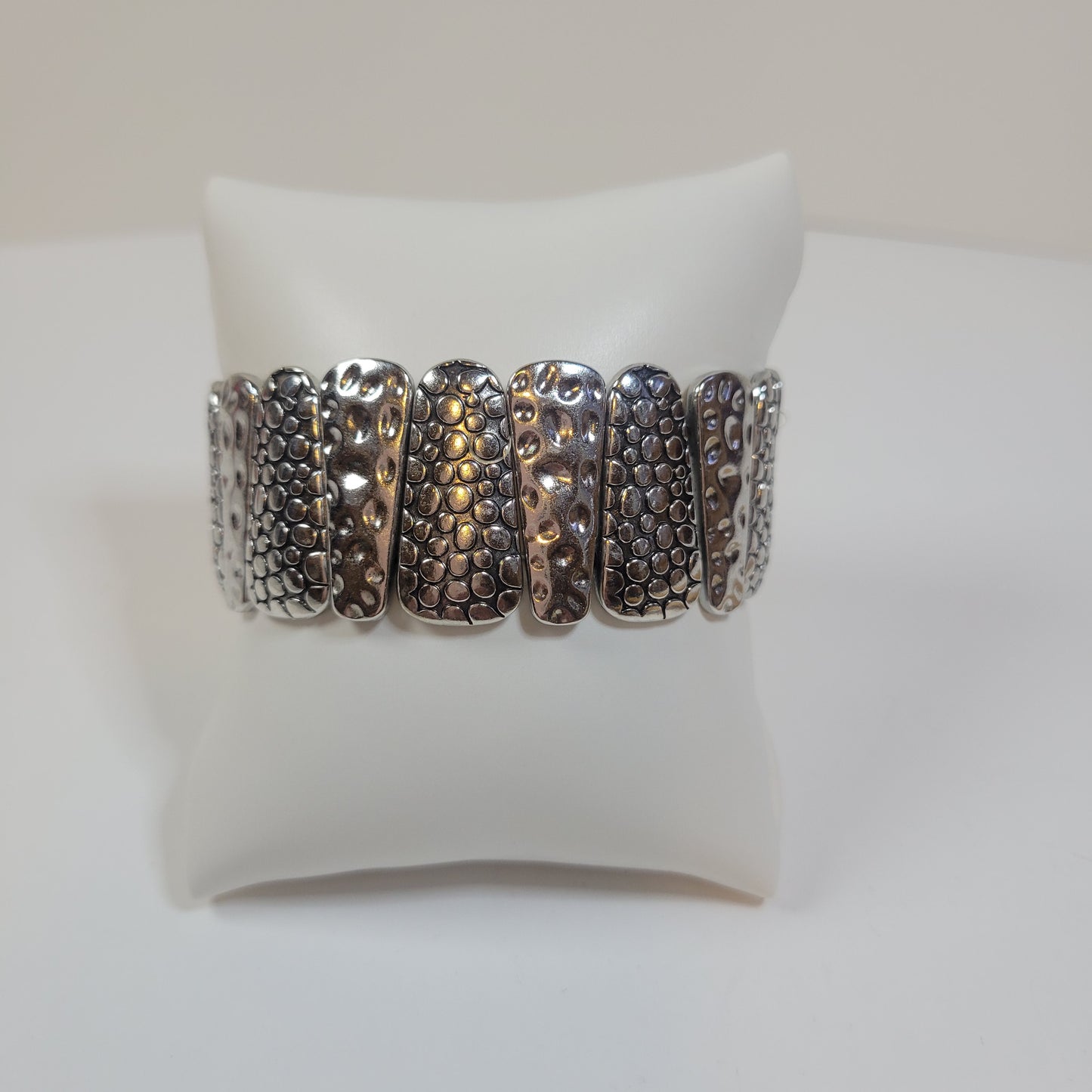 Silver-toned Bracelet with Asymmetric Pattern.