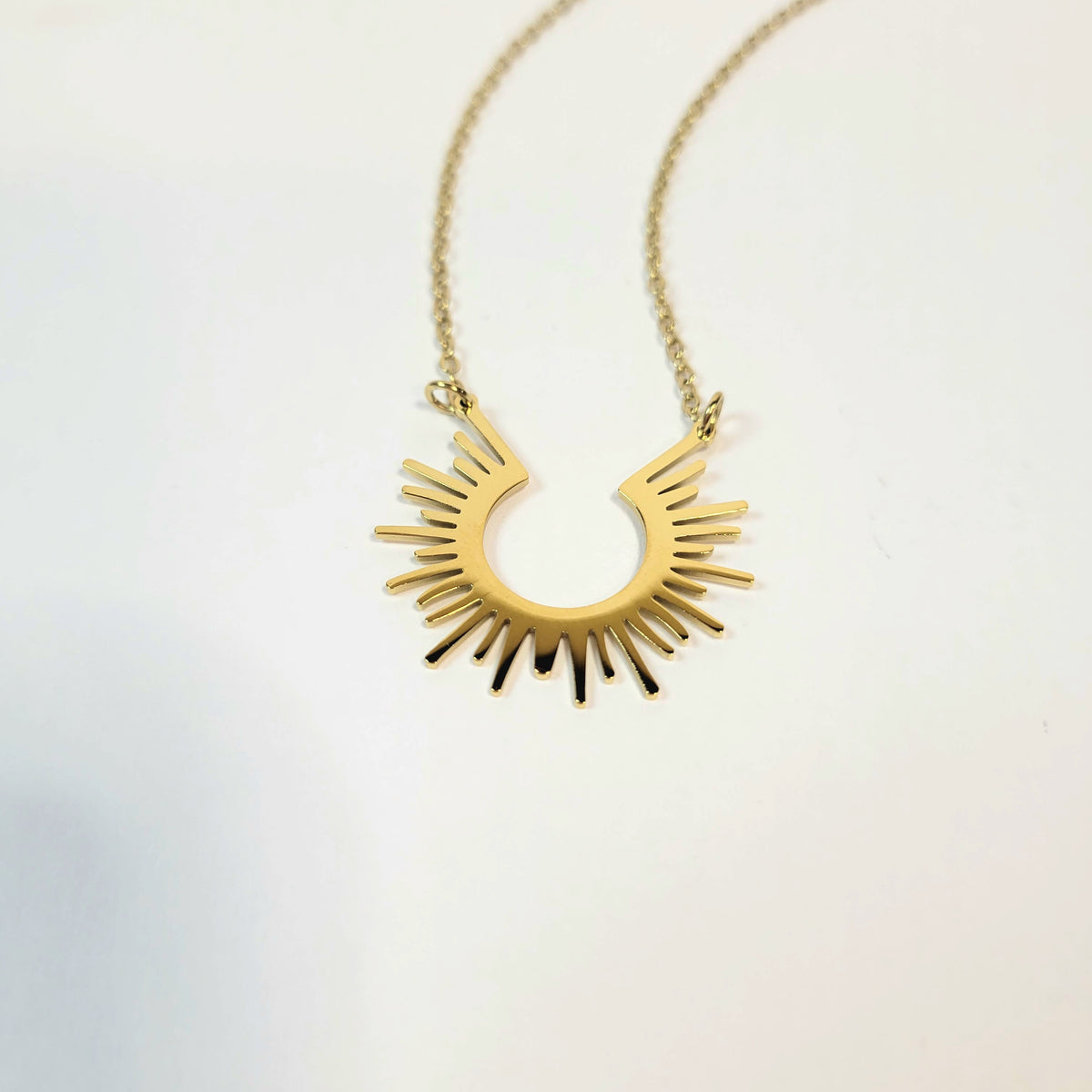 Open Sun Necklace. Gold or silver toned.